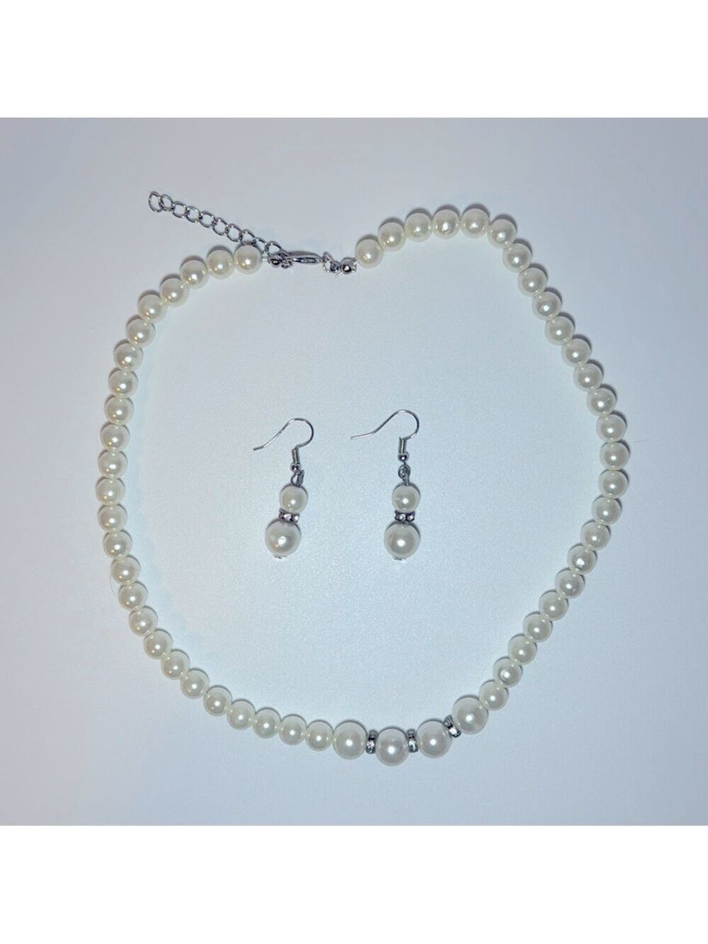 Costume pearls with drop earrings